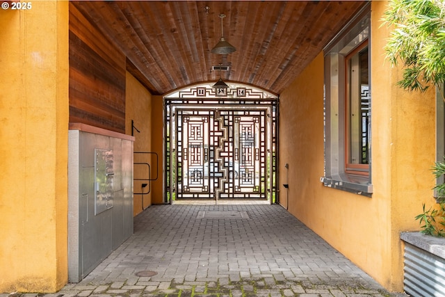 321 Mill St Unit 4, Eugene, OR 97401 - view of exterior entry featuring stucco siding and visible vents