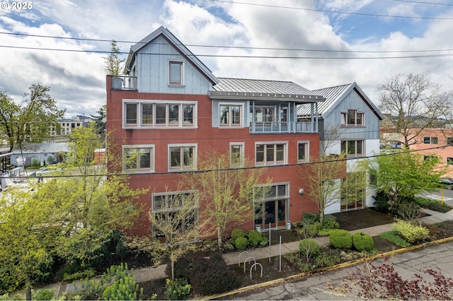321 Mill St Unit 4, Eugene, OR 97401 - view of front of house with a standing seam roof, metal roof, and a balcony