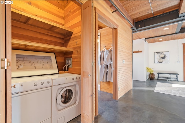 321 Mill St Unit 4, Eugene, OR 97401 - laundry room with wooden walls, washing machine and dryer, and laundry area