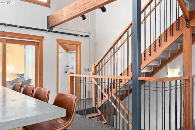 321 Mill St Unit 4, Eugene, OR 97401 - stairway featuring a high ceiling and beam ceiling