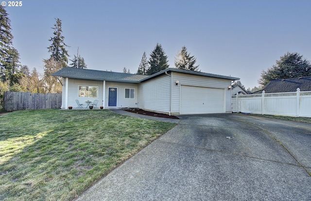 ranch-style home featuring a garage and a front yard