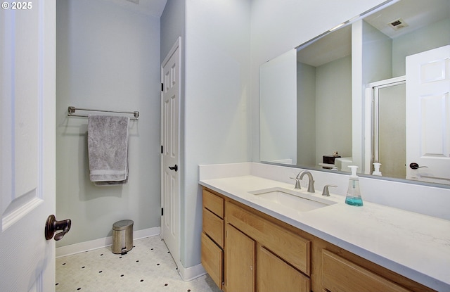 bathroom with vanity and an enclosed shower