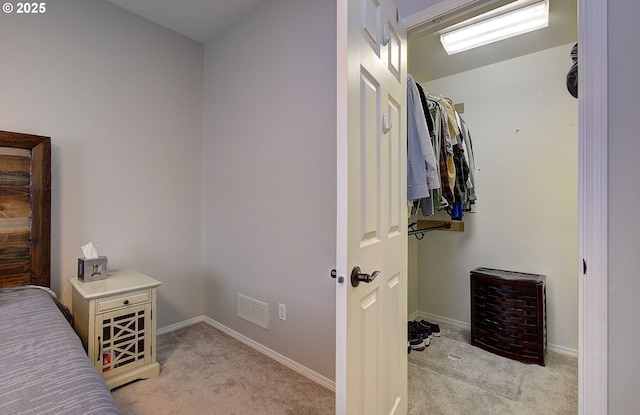 bedroom with light colored carpet