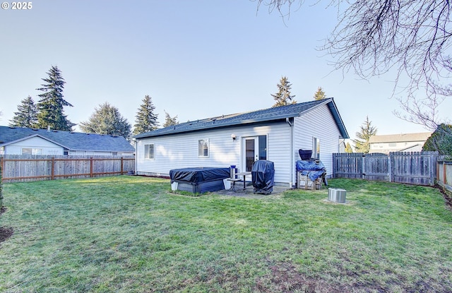 rear view of house with a lawn