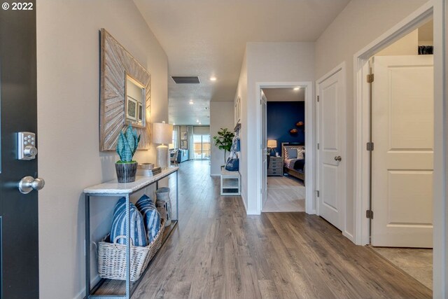 hall with wood-type flooring