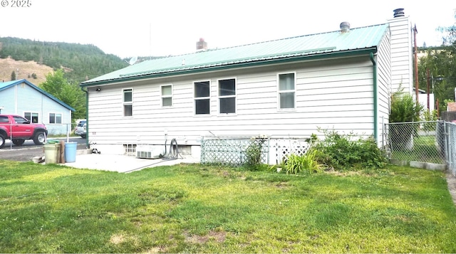 610 Bluff Rd, Klickitat, WA 98628 - rear view of house featuring a chimney, a metal roof, and a patio area