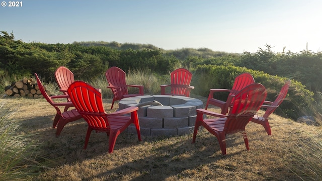 7304 SW Pacific Coast Hwy, Waldport, OR 97394 - view of yard featuring an outdoor fire pit and a forest view
