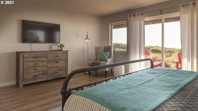 7304 SW Pacific Coast Hwy, Waldport, OR 97394 - bedroom featuring wood finished floors and baseboards