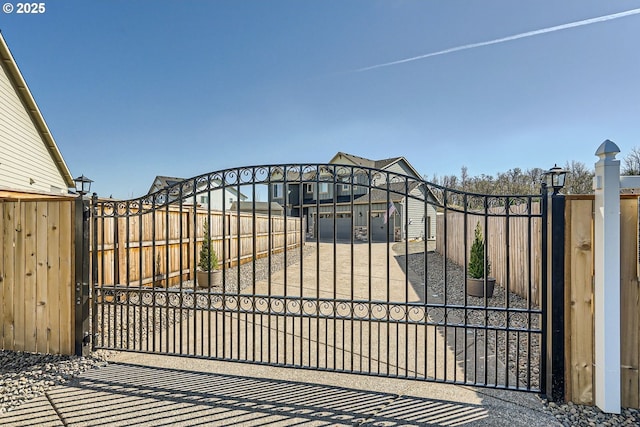 view of gate featuring fence