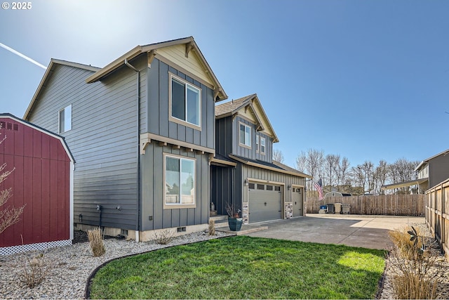 exterior space with crawl space, board and batten siding, a garage, and fence