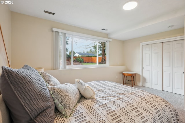 bedroom with a closet and carpet