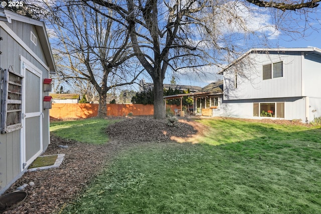 view of yard with a storage unit