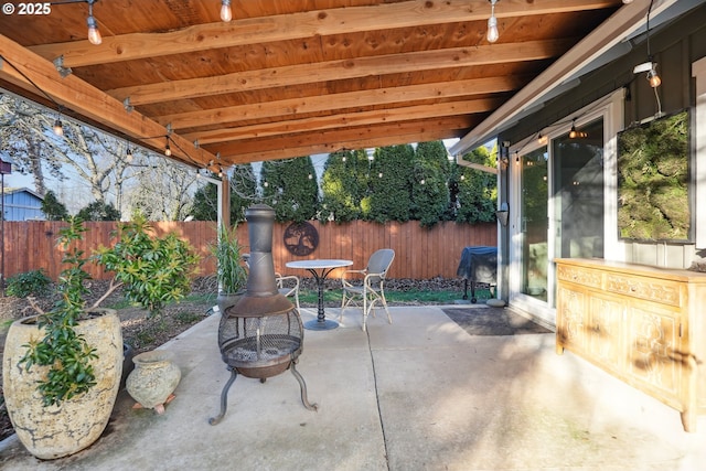 view of patio / terrace with a fire pit