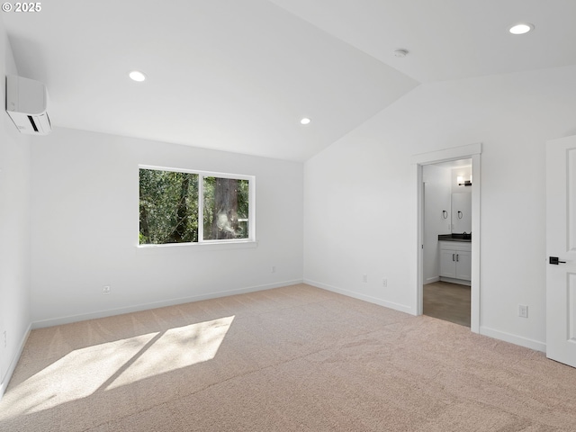 unfurnished bedroom featuring light colored carpet, vaulted ceiling, recessed lighting, baseboards, and a wall mounted air conditioner