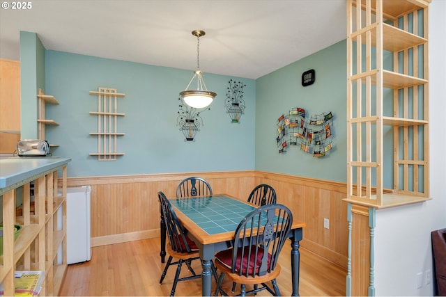 184 NE 10th Ave, Canby, OR 97013 - dining space with wood finished floors, wainscoting, and wood walls