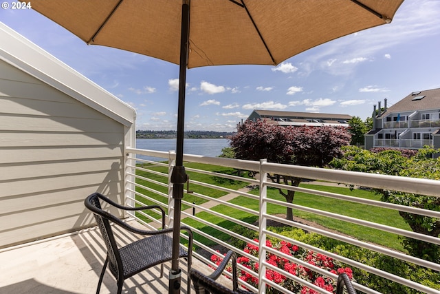 balcony featuring a water view