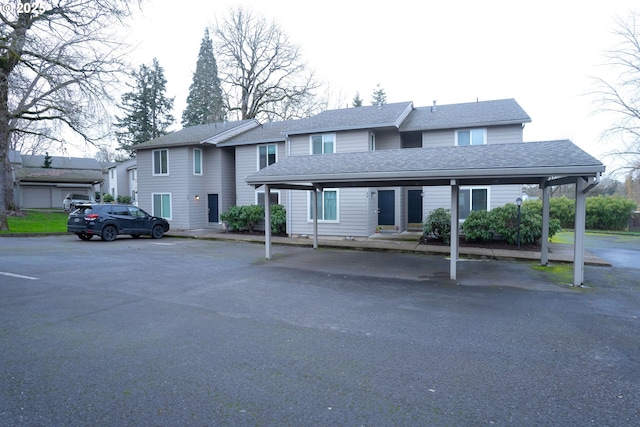 view of front of property featuring a carport