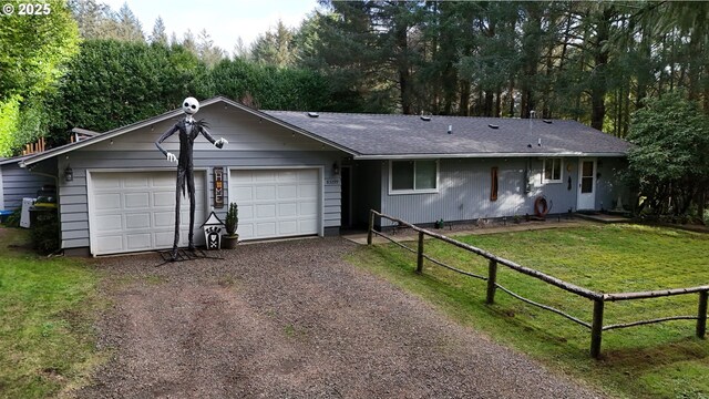 ranch-style home with a garage and a front yard