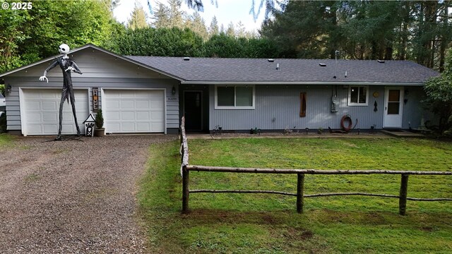 single story home featuring a front lawn and a garage