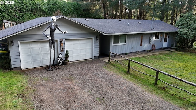 single story home with a front lawn and a garage