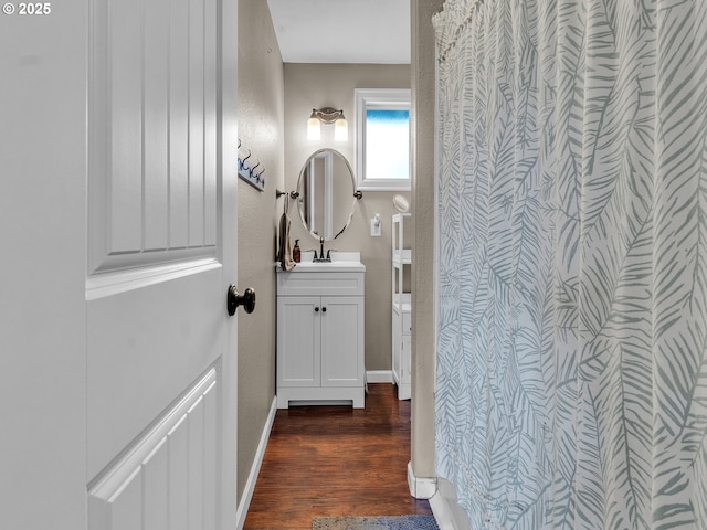 426 NE Hill St, Sheridan, OR 97378 - bathroom featuring vanity, wood finished floors, and baseboards