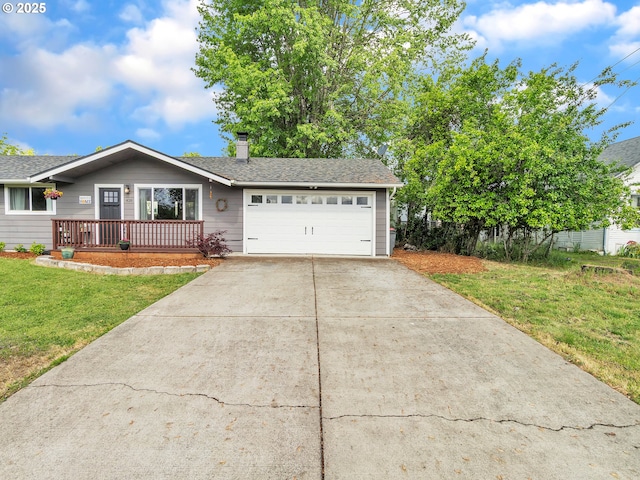 426 NE Hill St, Sheridan, OR 97378 - view of front facade featuring an attached garage, a front yard, driveway, a chimney, and a porch