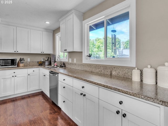 426 NE Hill St, Sheridan, OR 97378 - kitchen featuring appliances with stainless steel finishes, a sink, white cabinets, light stone countertops, and recessed lighting