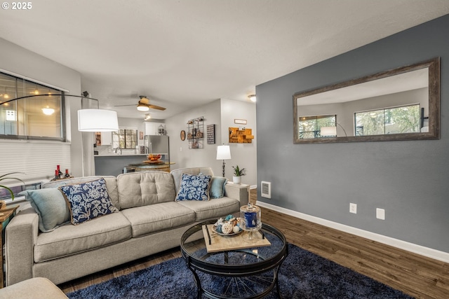 living room with ceiling fan and wood-type flooring