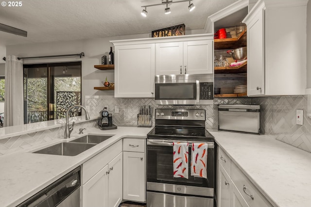 kitchen featuring sink, white cabinetry, and stainless steel appliances