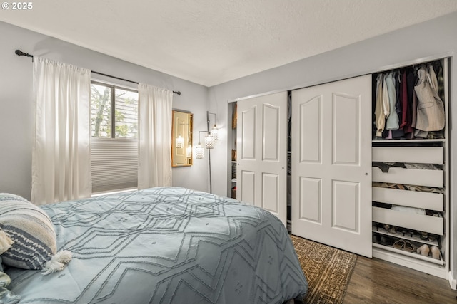 bedroom featuring a closet and dark hardwood / wood-style floors