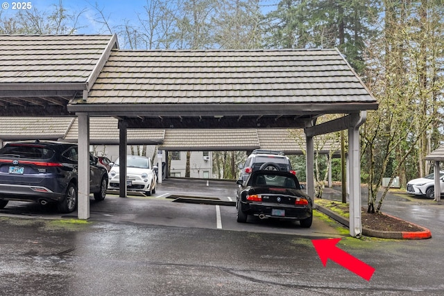 view of parking / parking lot featuring a carport