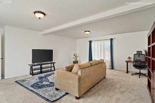 living room featuring beamed ceiling, carpet floors, and a textured ceiling