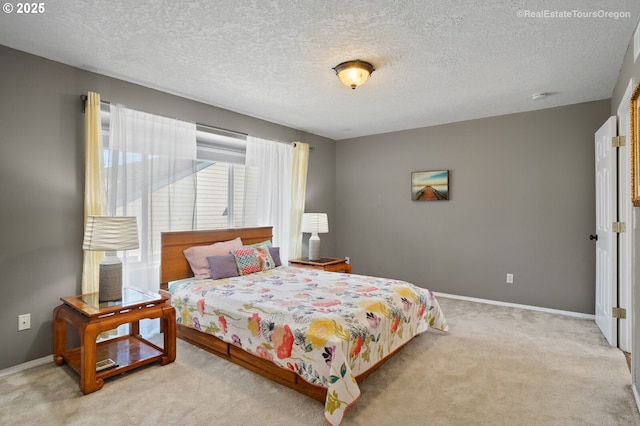 carpeted bedroom with a textured ceiling