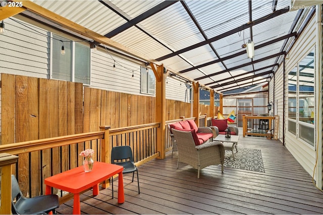 wooden terrace featuring a pergola and outdoor lounge area