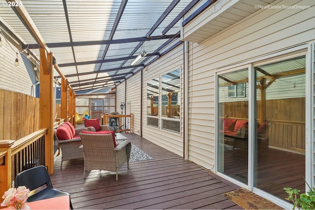 wooden terrace with an outdoor hangout area