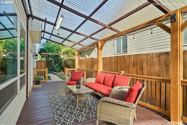 wooden terrace featuring an outdoor hangout area and a pergola