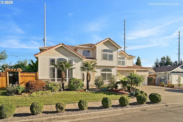 view of front of house featuring a garage and a front yard