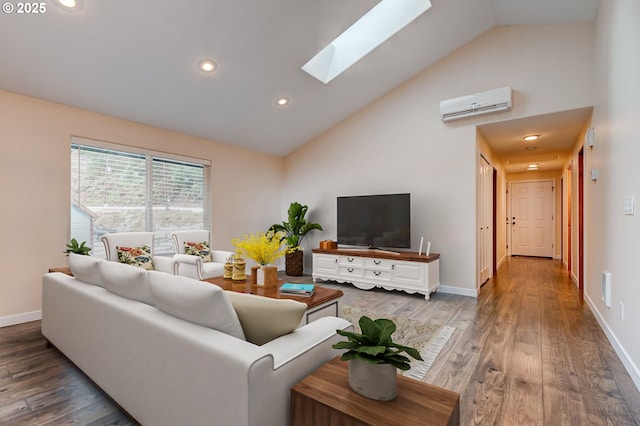 living room featuring a skylight, baseboards, wood finished floors, and a wall mounted air conditioner