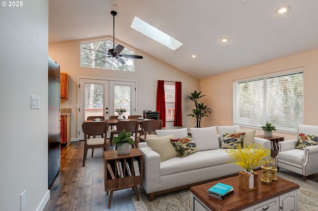 living room with a skylight, baseboards, dark wood finished floors, french doors, and recessed lighting