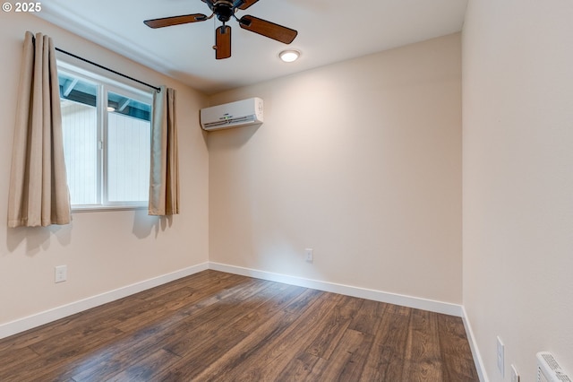 empty room featuring a ceiling fan, baseboards, dark wood-style flooring, and an AC wall unit