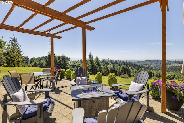 17385 NE Fairview Dr, Dundee, OR 97115 - view of patio / terrace with a forest view, an outdoor fire pit, a pergola, and outdoor dining space
