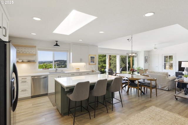 17385 NE Fairview Dr, Dundee, OR 97115 - kitchen with fridge with ice dispenser, stainless steel dishwasher, plenty of natural light, light countertops, and recessed lighting