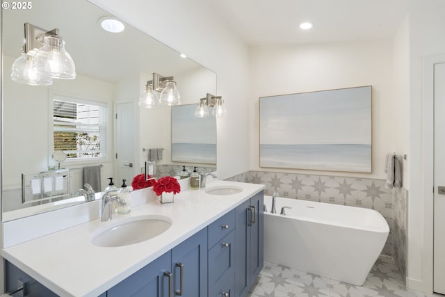 17385 NE Fairview Dr, Dundee, OR 97115 - full bathroom with a freestanding tub, double vanity, recessed lighting, and tile walls