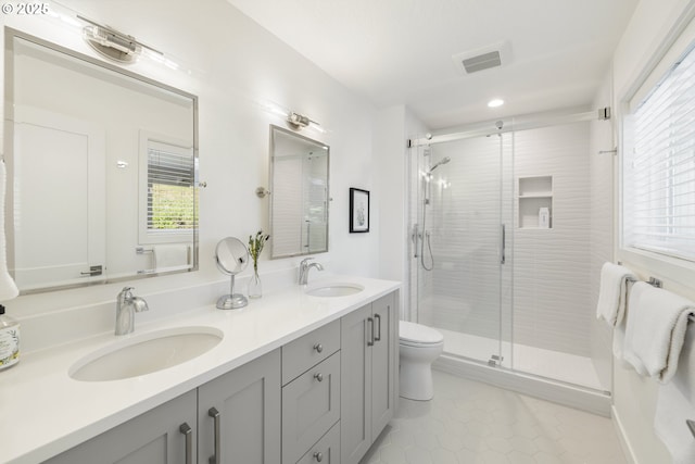 17385 NE Fairview Dr, Dundee, OR 97115 - full bathroom featuring double vanity, a stall shower, toilet, and tile patterned flooring