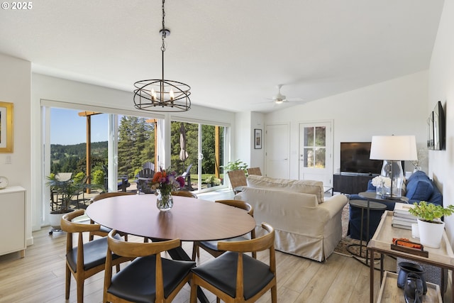 17385 NE Fairview Dr, Dundee, OR 97115 - dining space featuring light wood-type flooring, a ceiling fan, a chandelier, and vaulted ceiling