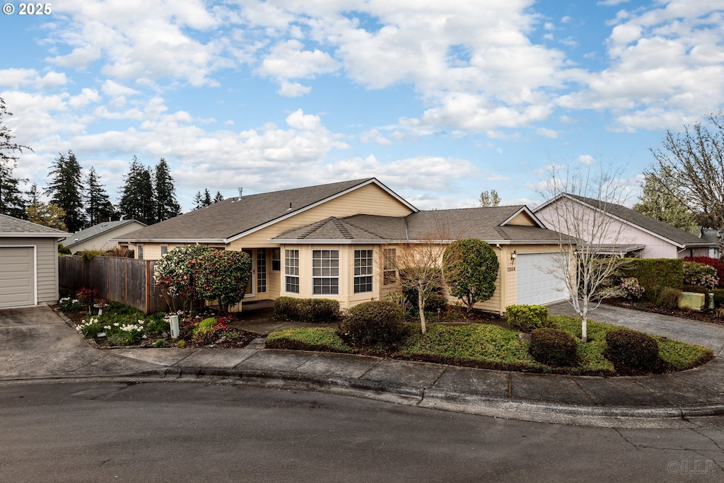 12554 SW Peachvale St, Portland, OR 97224 - single story home with concrete driveway and an attached garage
