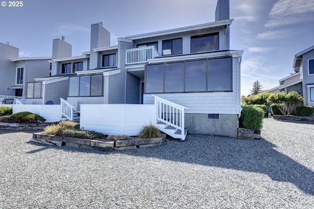 821 5th Ave, Hammond, OR 97121 - rear view of property featuring a chimney and stairway