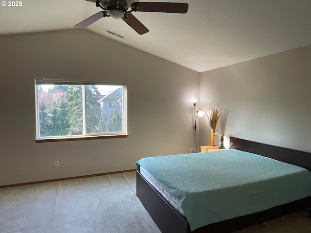 bedroom featuring baseboards, vaulted ceiling, light carpet, a ceiling fan, and visible vents