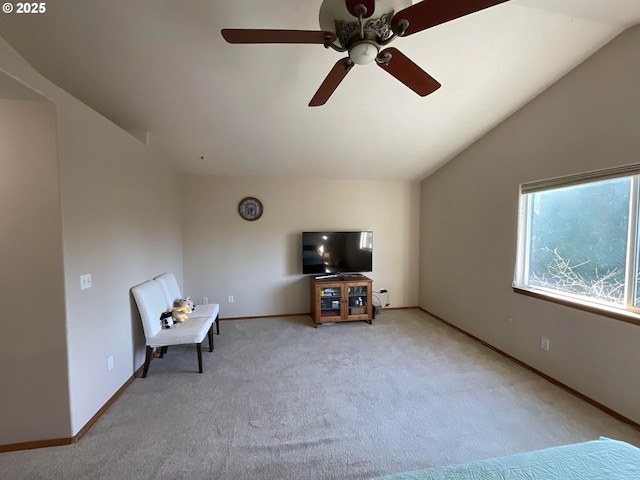 sitting room with ceiling fan, baseboards, carpet, and lofted ceiling