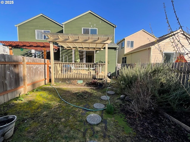 back of property featuring a pergola and fence private yard